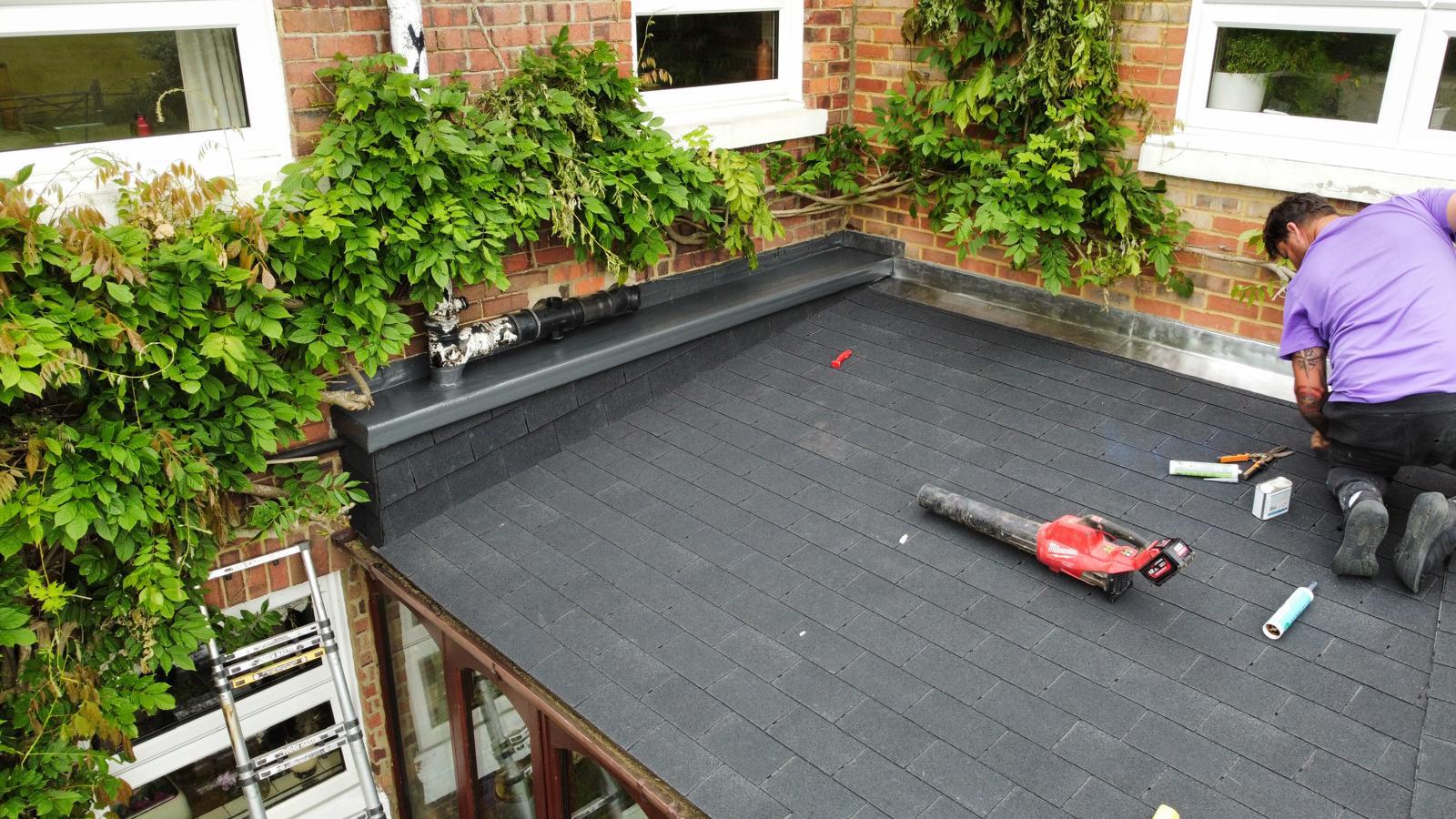 old conservatory roof that’s been turned into a felt shingle roof